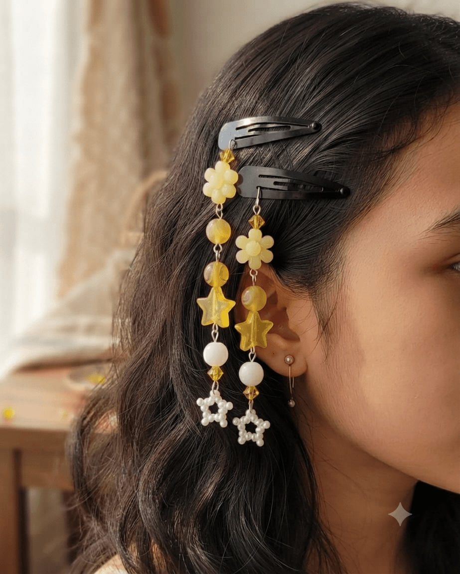 Woman wearing matching yellow floral dangling beaded hair clips in her hair